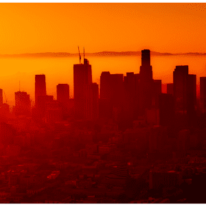 Overlook of bright orange-lit city.